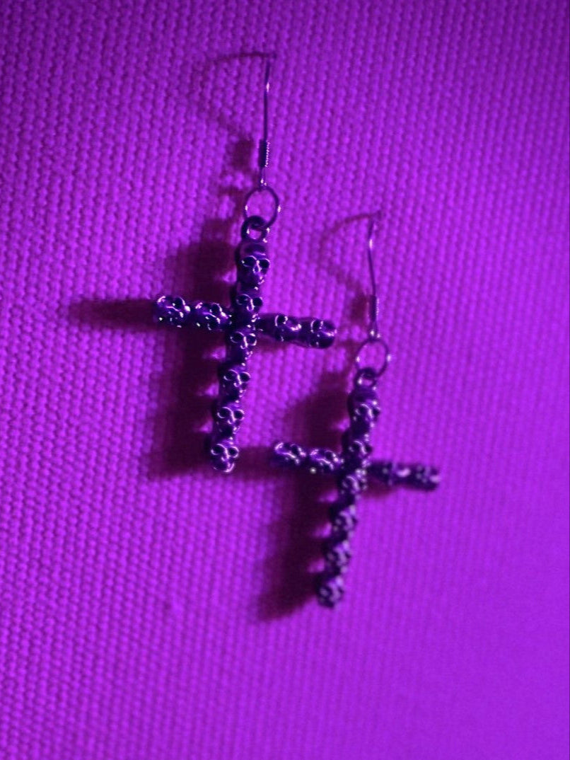 Crucifix In Skulls Earring